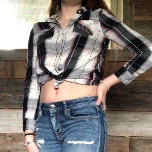 This is a flannel button up with pink strips.